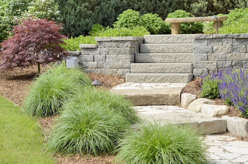 Hardscaping Services Hardscaped outdoor living area with defined edges