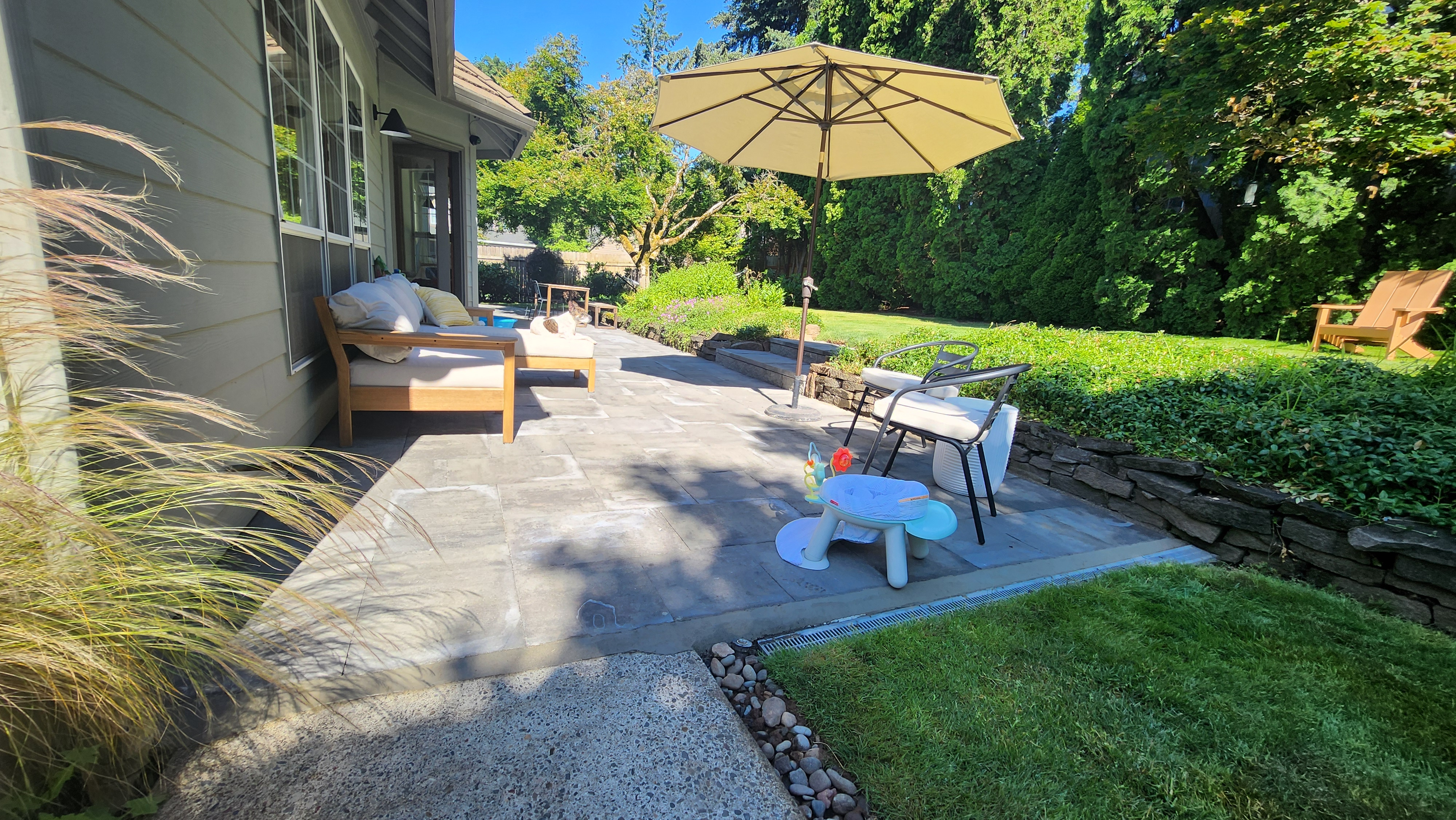 patio-after1 Finished stone paver patio with lawn and garden
